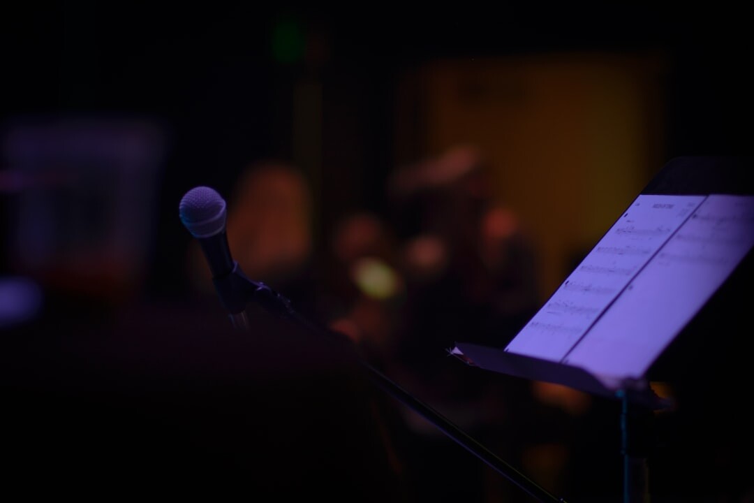 Dark stage with spotlight and microphone before an event