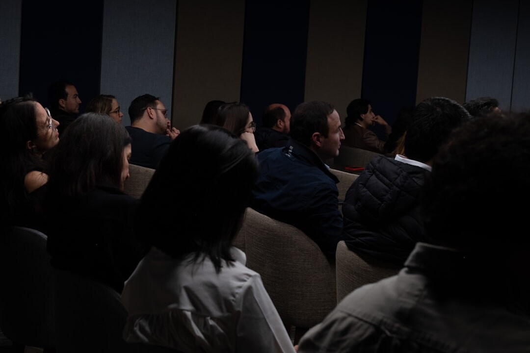 Panel discussion at a conference with moderator and speakers
